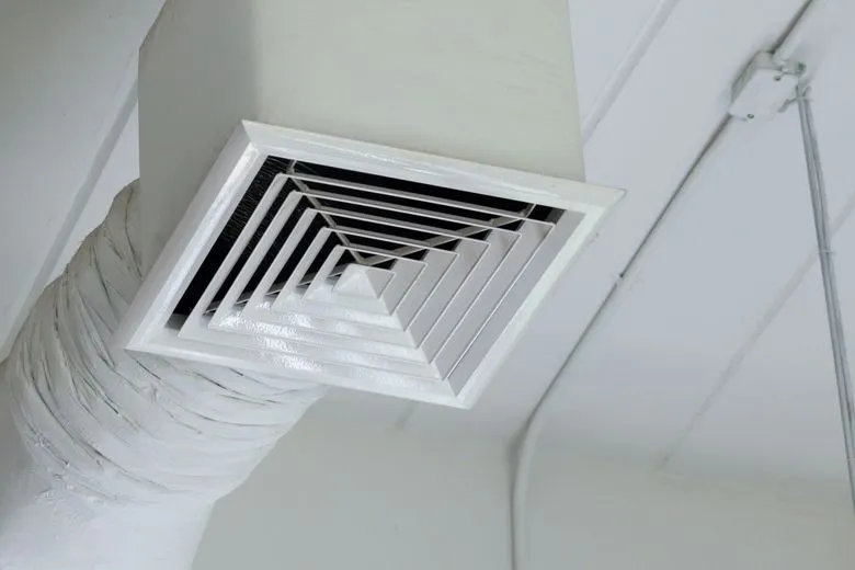 Close up of an air vent on a ceiling